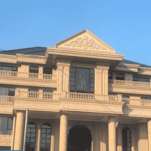 淄博黄金麻别墅外墙干挂石材效果示例